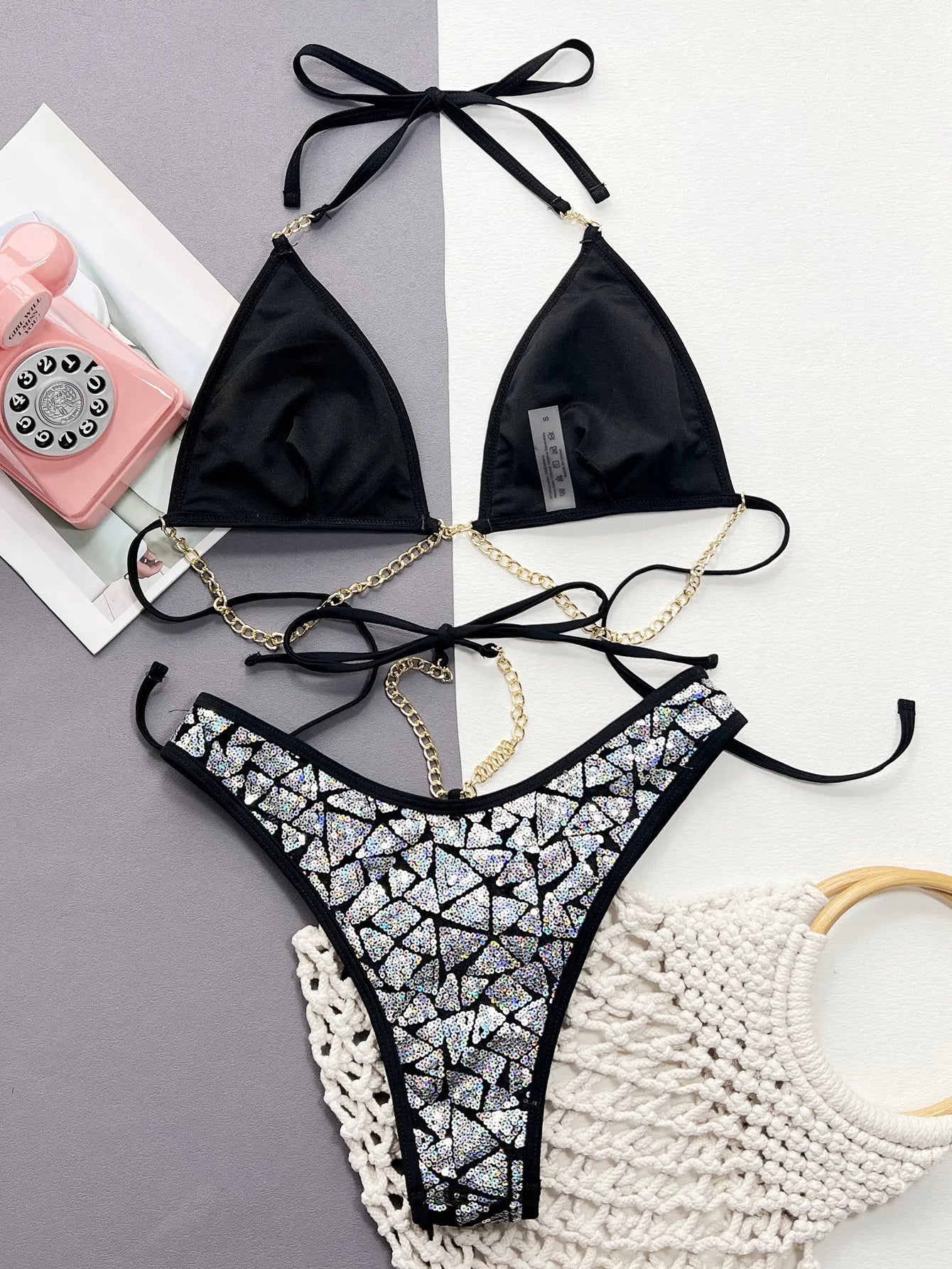 Women's silver black bikini swimsuit with metallic chain design on polyester fabric