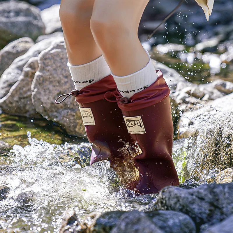 A pair of high tube PVC rain boots for men and women in a choice of colours.