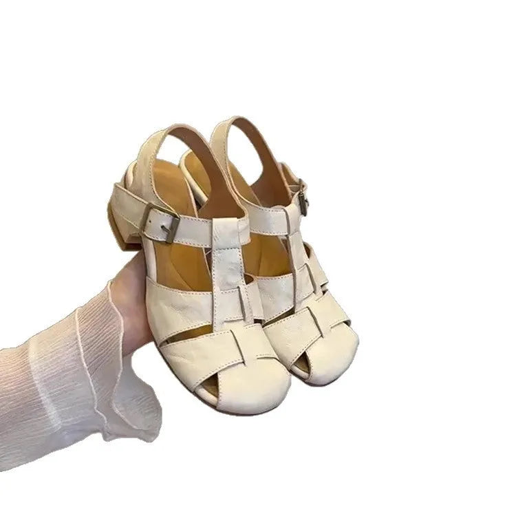 Women's apricot buckle shoes with round toe, two-layer cowhide upper, and rubber sole on a plain background