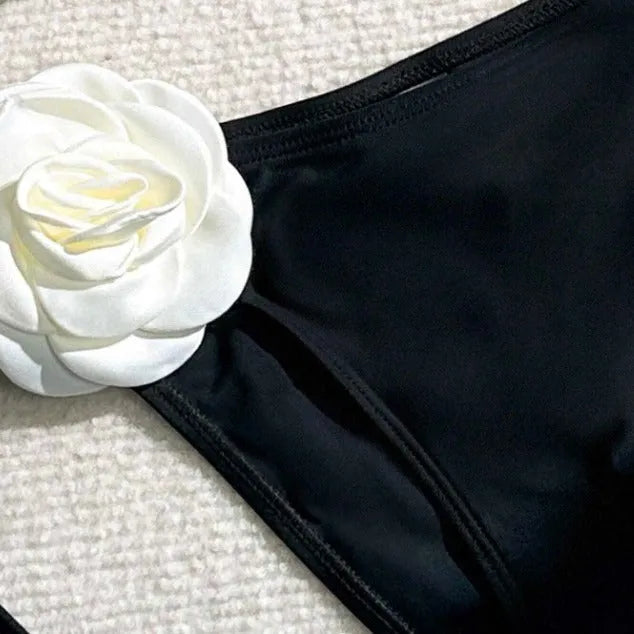 Black women's bikini set with 3D flower patterns, drawstring waist, and backless briefs design