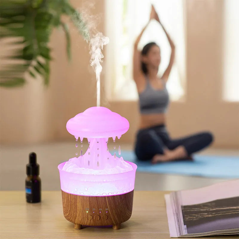Wood grain finished rain cloud humidifier diffuser with coloured LED night light on table