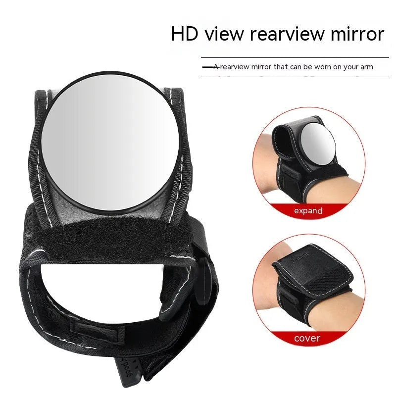 Black nylon cycling wrist rear-view mirror showing strap attachment and mirror positioning