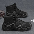 Black canvas high-top tactical boot with rubber sole and cross strap detail on a white background.