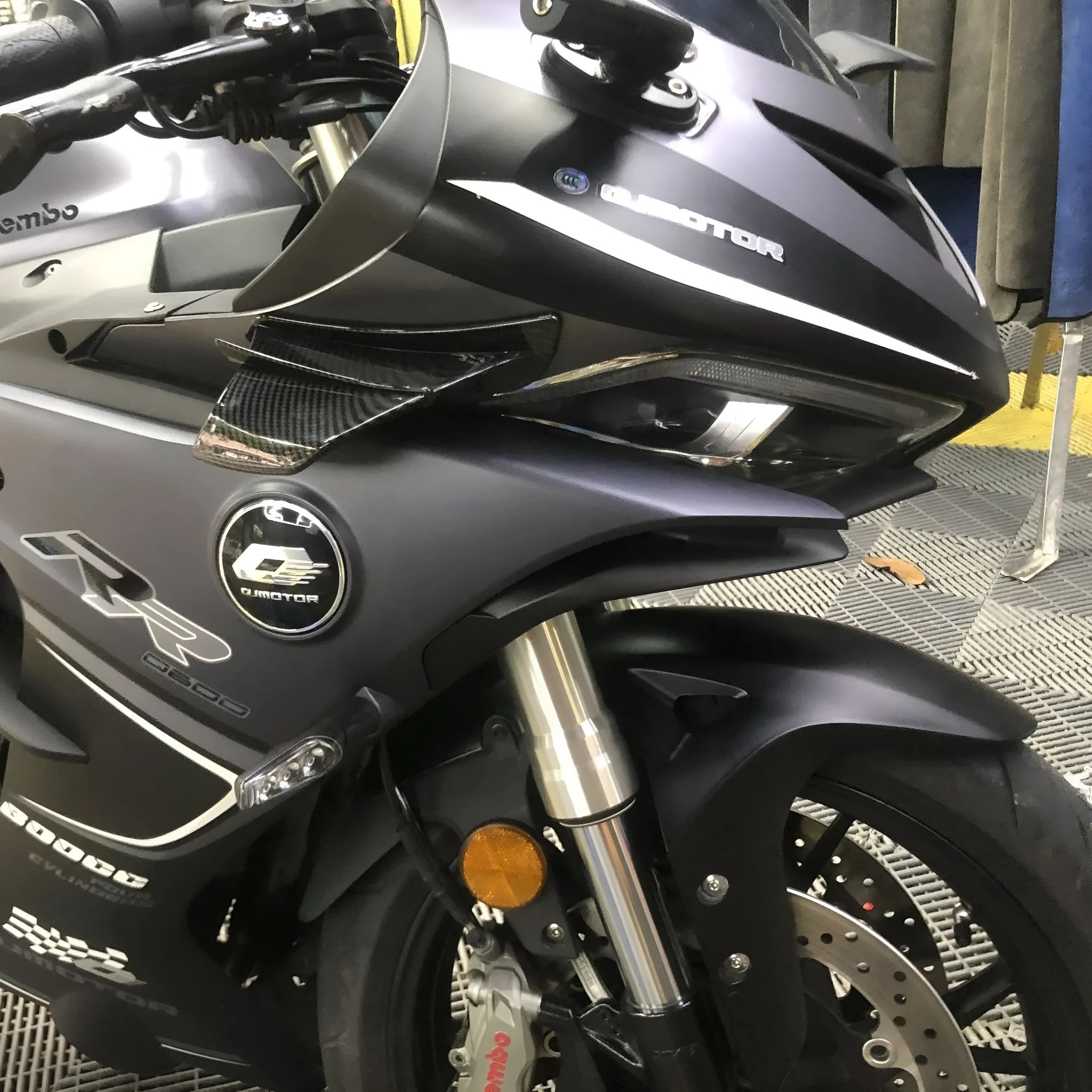 Universal motorcycle spoiler wing accessory in black, measuring 18cm by 8cm