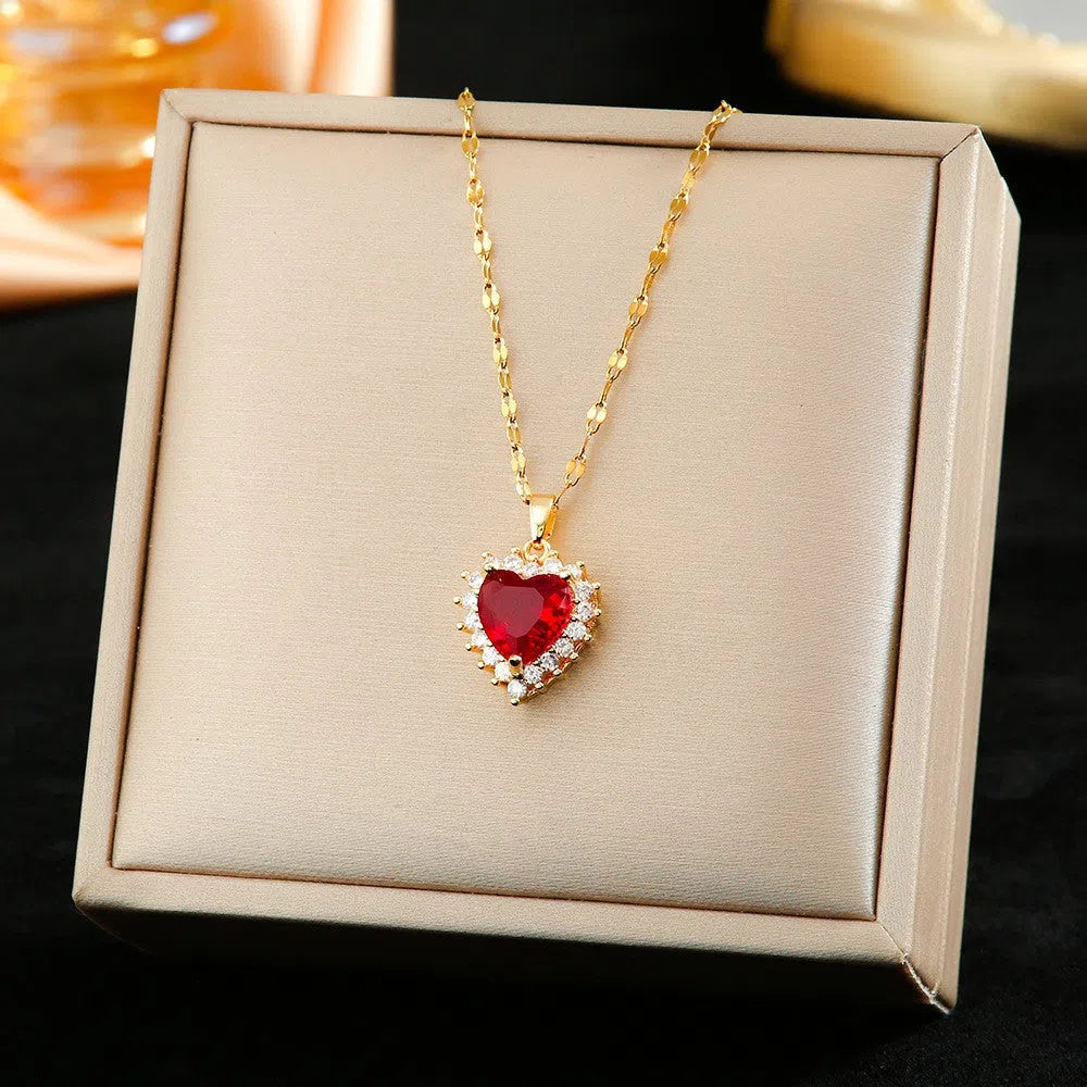 Gold red titanium steel heart pendant necklace with mixed gem inlay and water wave chain