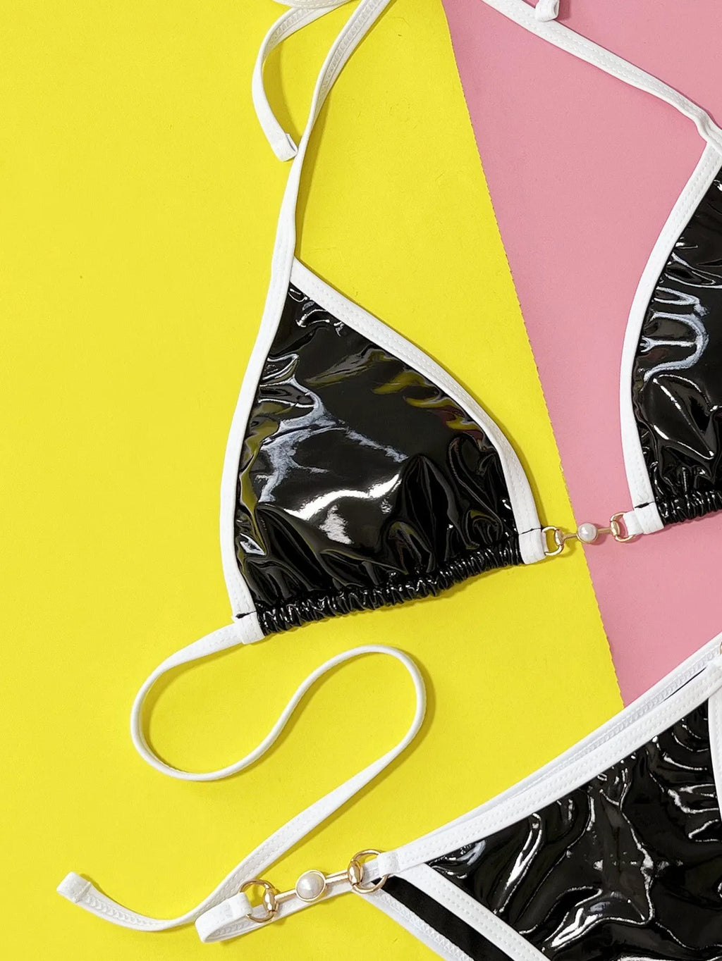 Black women's bikini swimsuit set with triangle top and split briefs on a mannequin.