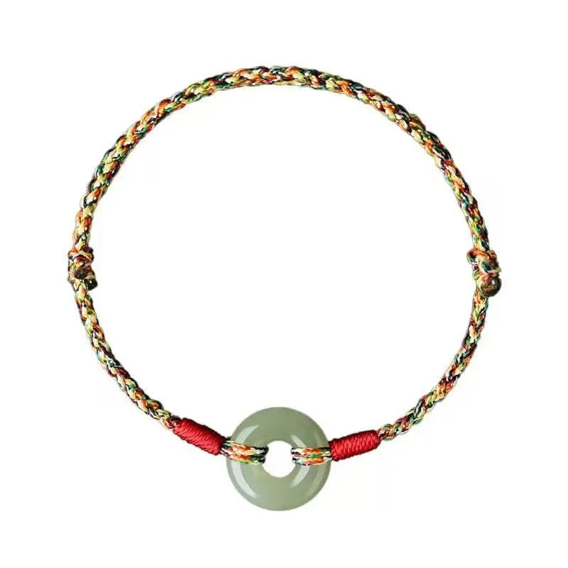 Colourful braided rope bracelet with silver peace buckle on woven wristband