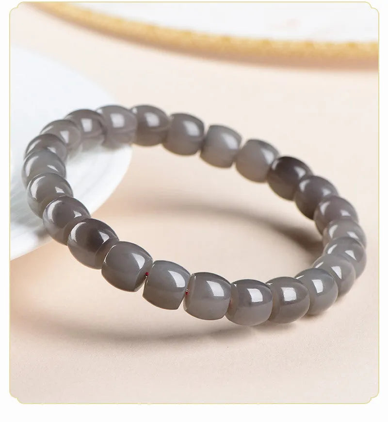 Natural Smokey Violet Hetian Jade straight cut bracelet with polished 8x9mm beads on an elasticated band.
