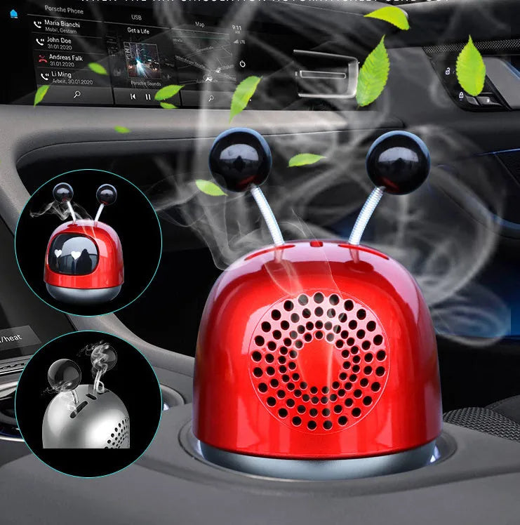 Robot-shaped car vent air freshener ornament in blue, grey or red with gel fragrance.