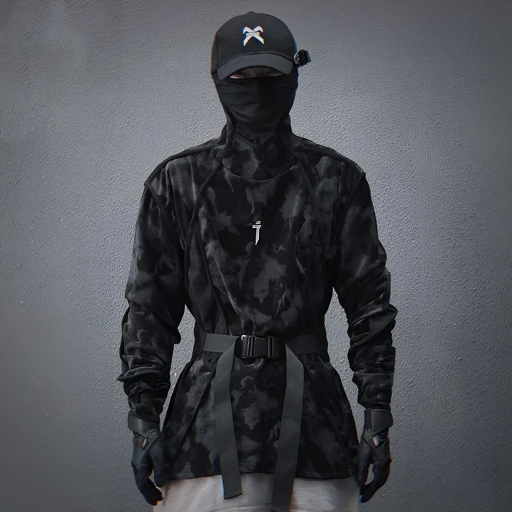 Man wearing a black tie dye print loose pullover sweater with drop-shoulder sleeves.
