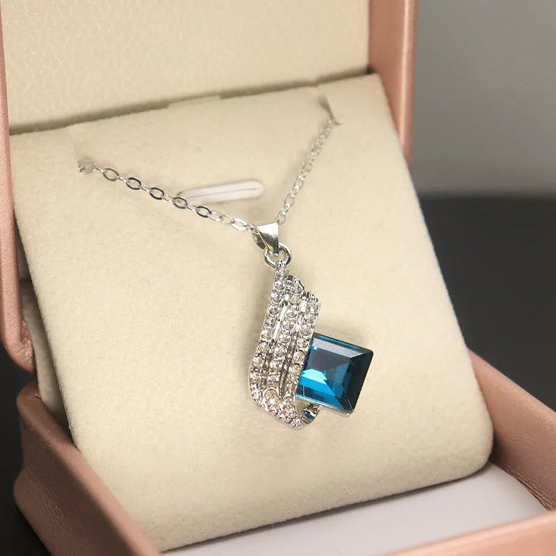 Fashion jewellery set showing alloy pendant necklace with cross chain and matching glass ear studs