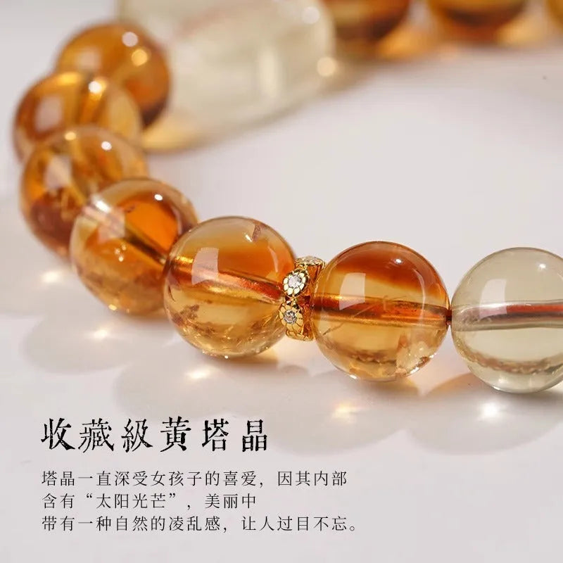 Women's carved citrine bracelet with geometric ethnic patterning, 10mm crystal construction