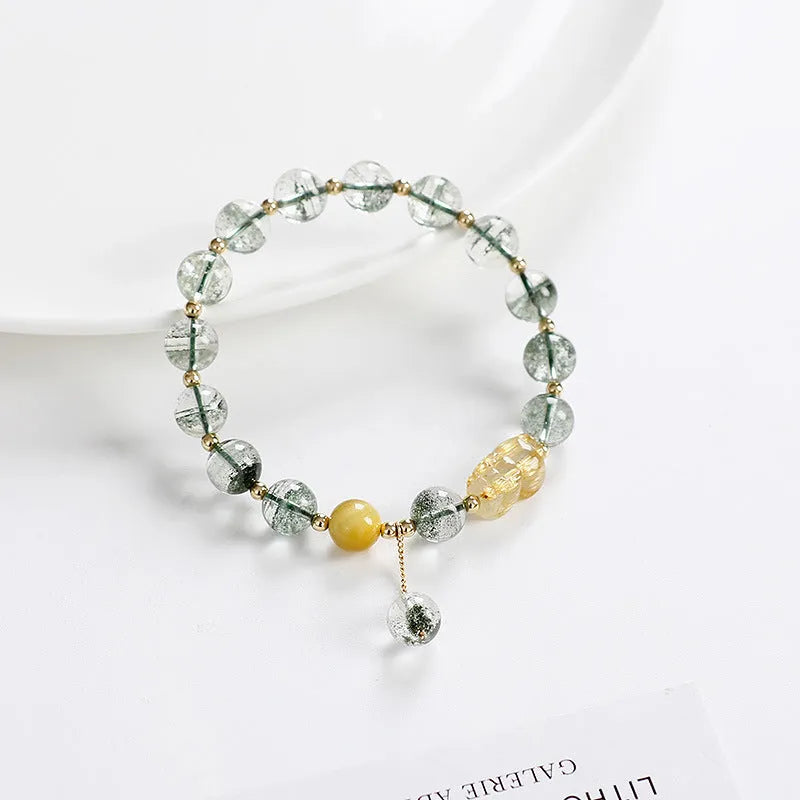 Green phantom quartz crystal bracelet with gold rutile needles and 8mm geometric beads
