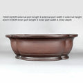 Handmade antique Chinese style purple clay flowerpot shaped like a crabapple fruit.