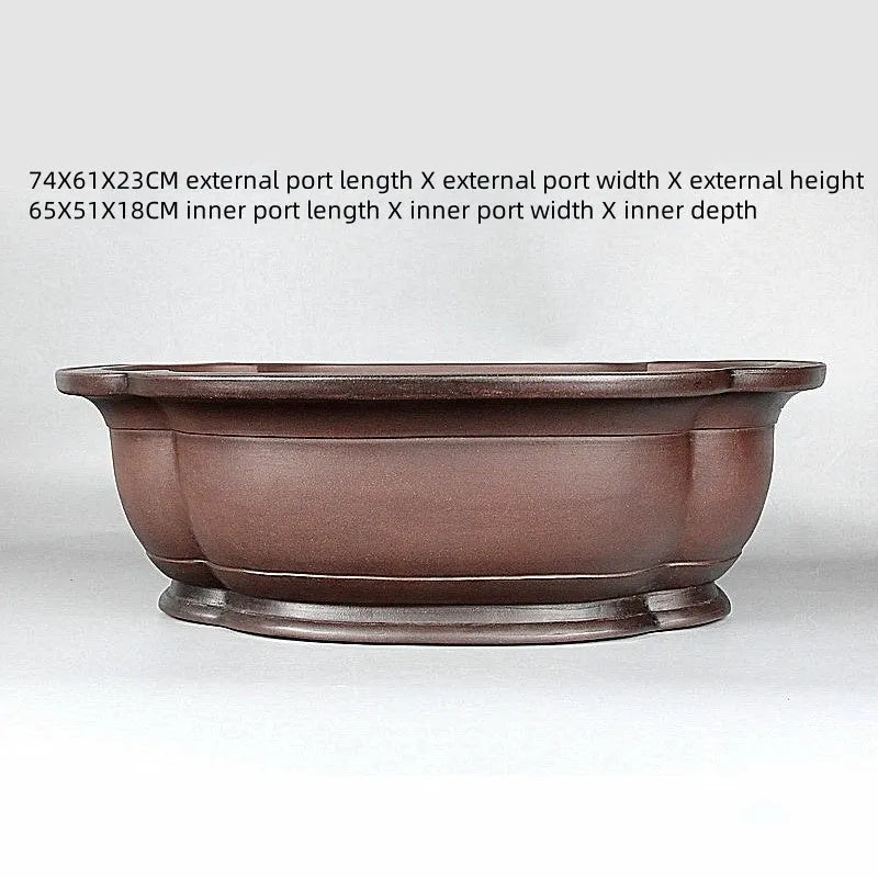 Handmade antique Chinese style purple clay flowerpot shaped like a crabapple fruit.