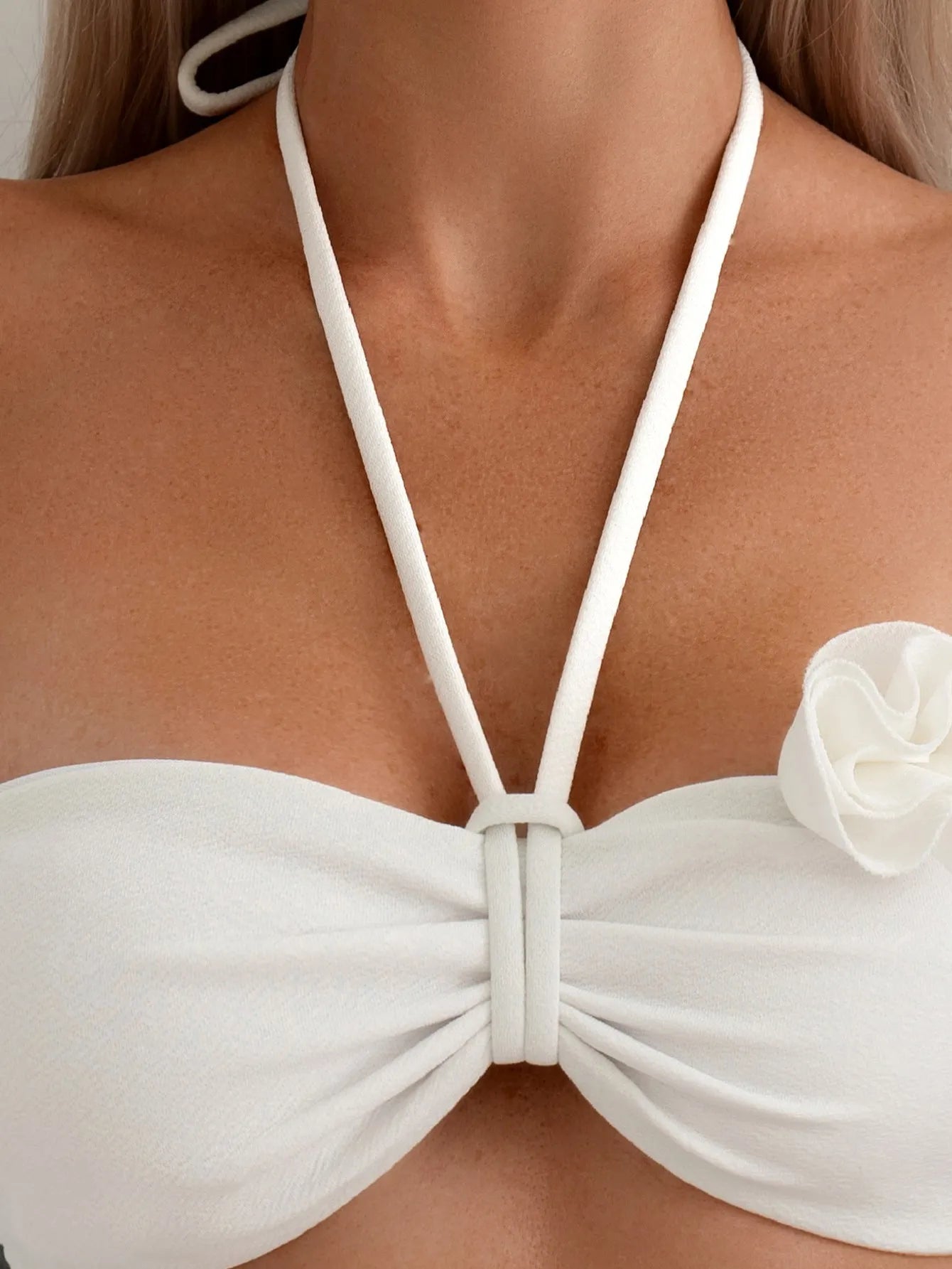 White women's halter lace-up bikini with three-dimensional floral pattern and briefs