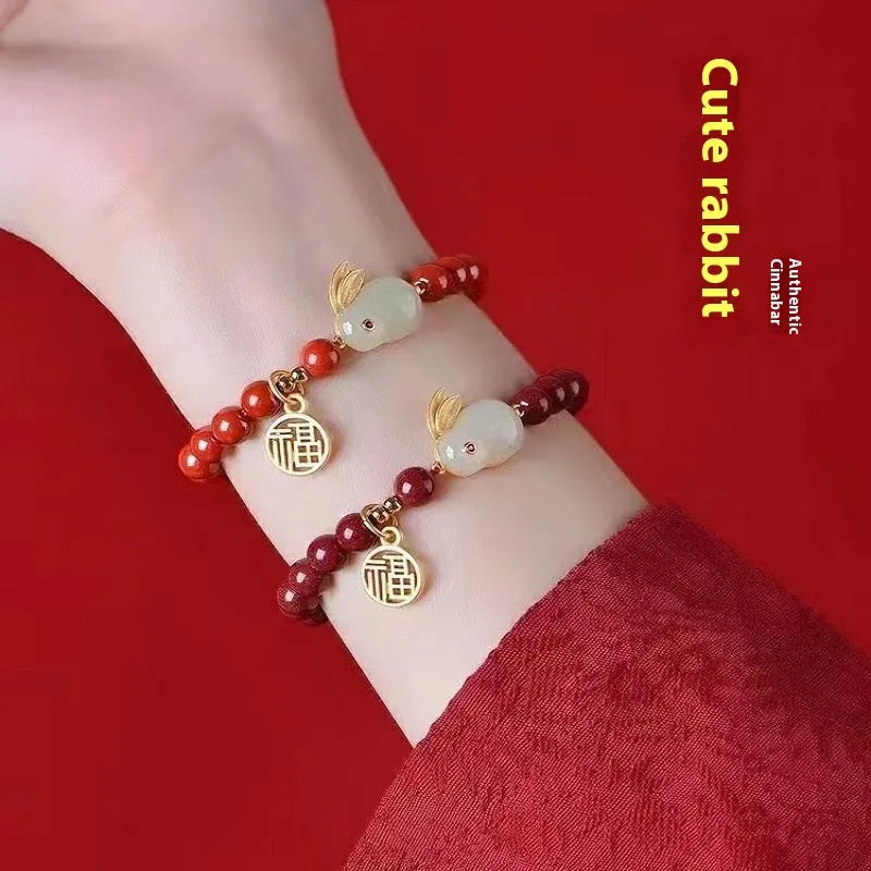 Purple Gold Sand cinnabar bracelet with jade hare charm, shown in 6mm and 8mm bead sizes.