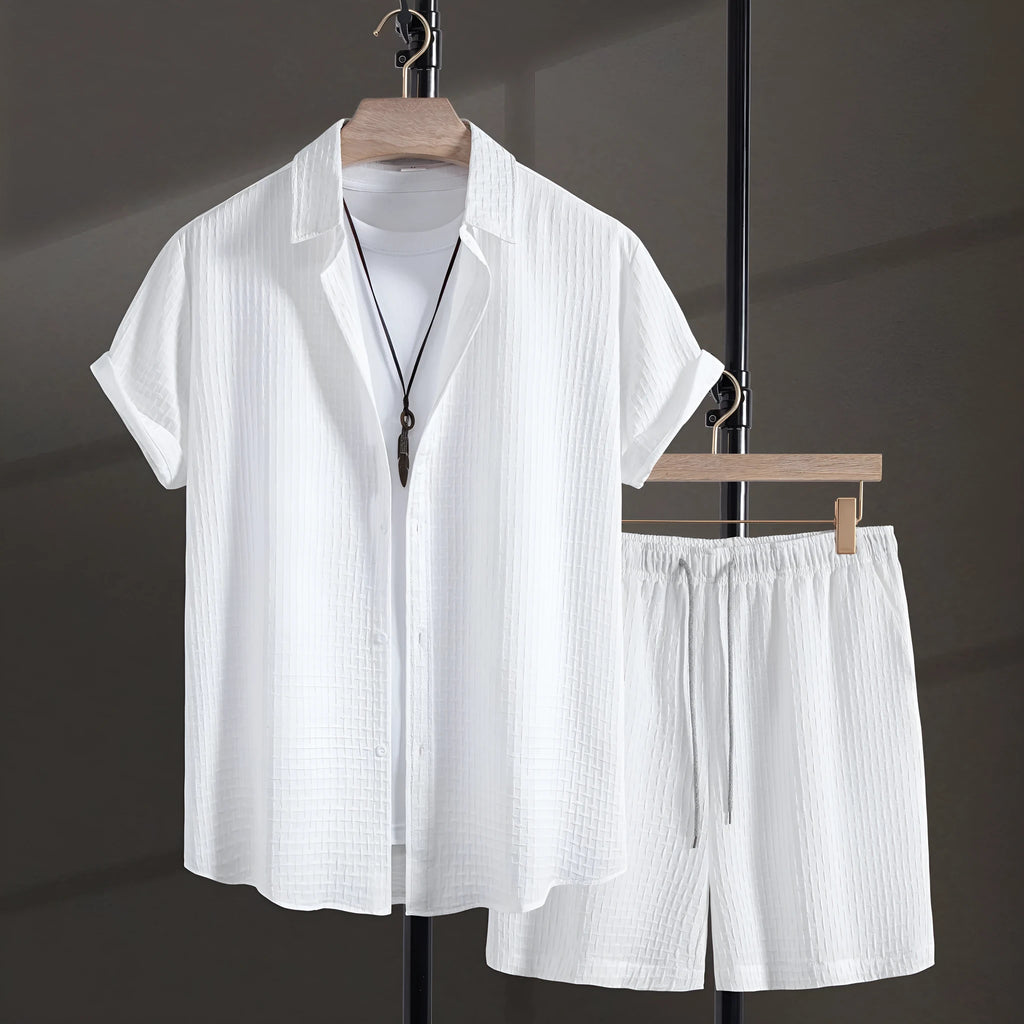 Men's white cotton blend short sleeve shirt and matching shorts beach suit laid flat.