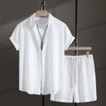 Men's white cotton blend short sleeve shirt and matching shorts beach suit laid flat.