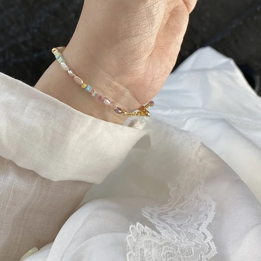 Natural irregular pearl bracelet and necklace set in 14k gilded purple silver tone.