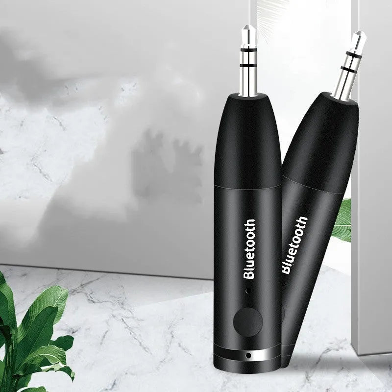 Black Bluetooth audio receiver with 3.5mm aux jack for car stereo wireless music streaming