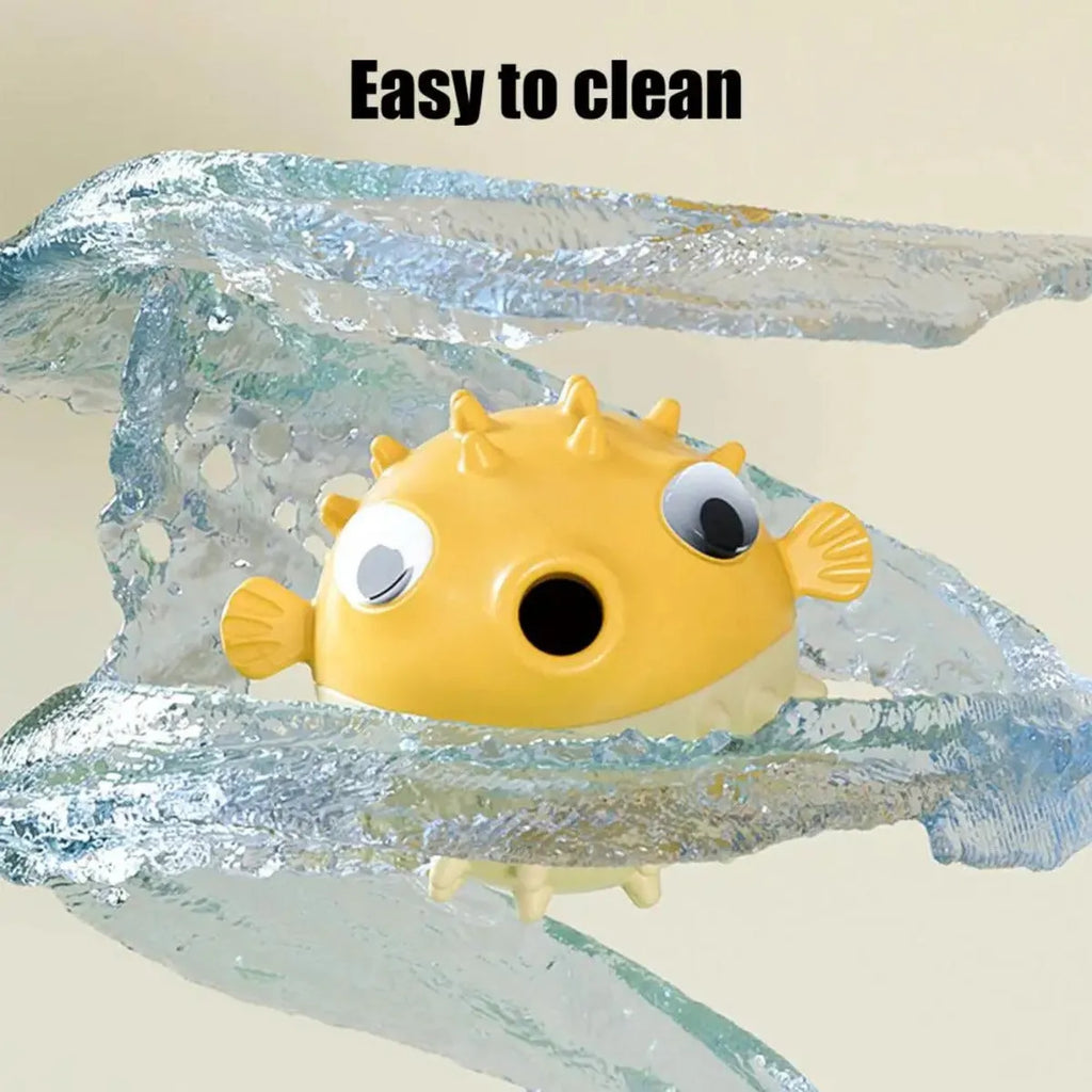 Yellow durable fish-shaped vinyl dog chew toy with textured surface and squeaker.