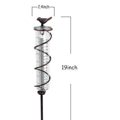 Cast iron garden rain gauge with decorative hummingbird design showing measurement scale