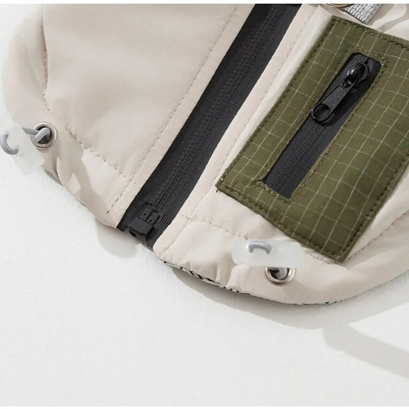 Khaki plaid and beige padded dog windbreaker with built-in leash ring and zipper pocket