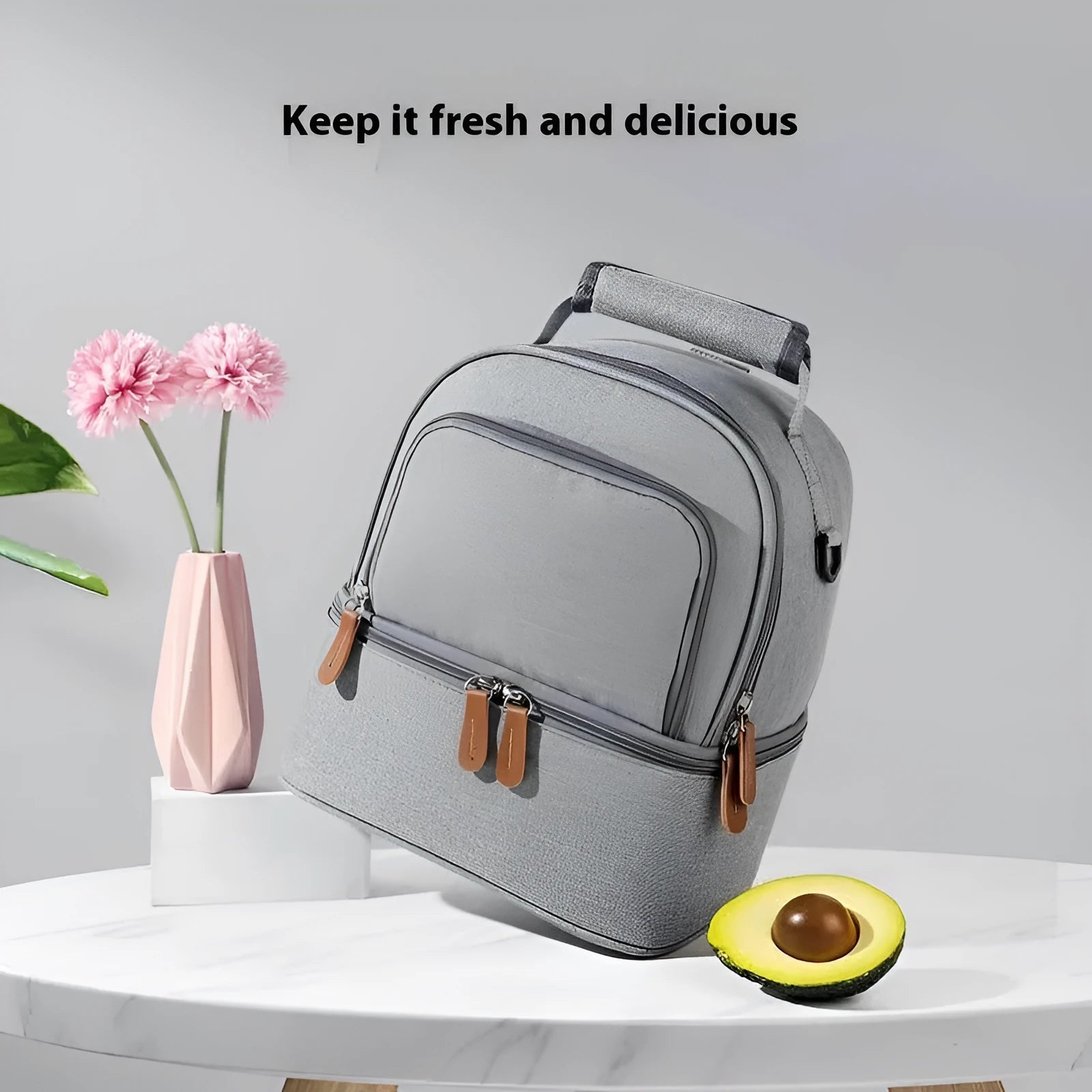 Grey women's thermal insulation backpack made of Oxford cloth with a curved shoulder strap.
