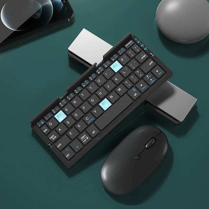Aluminium folding Bluetooth keyboard with stand holding a smartphone