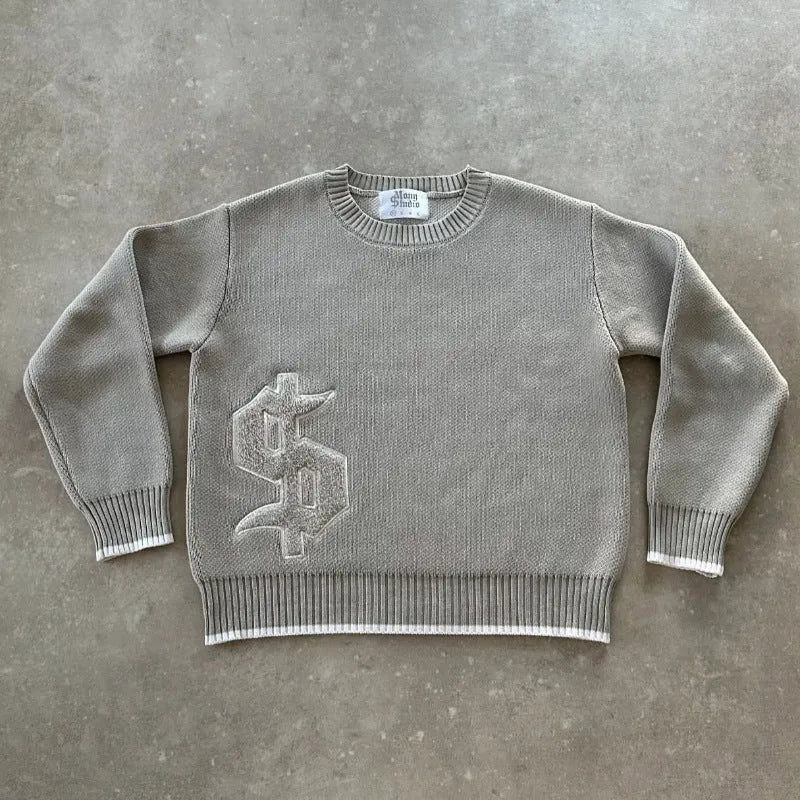 Gray loose-fitting Jacquard knitwear coat with long sleeves on a hanger.