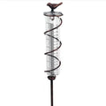 Cast iron garden rain gauge with decorative hummingbird design showing measurement scale
