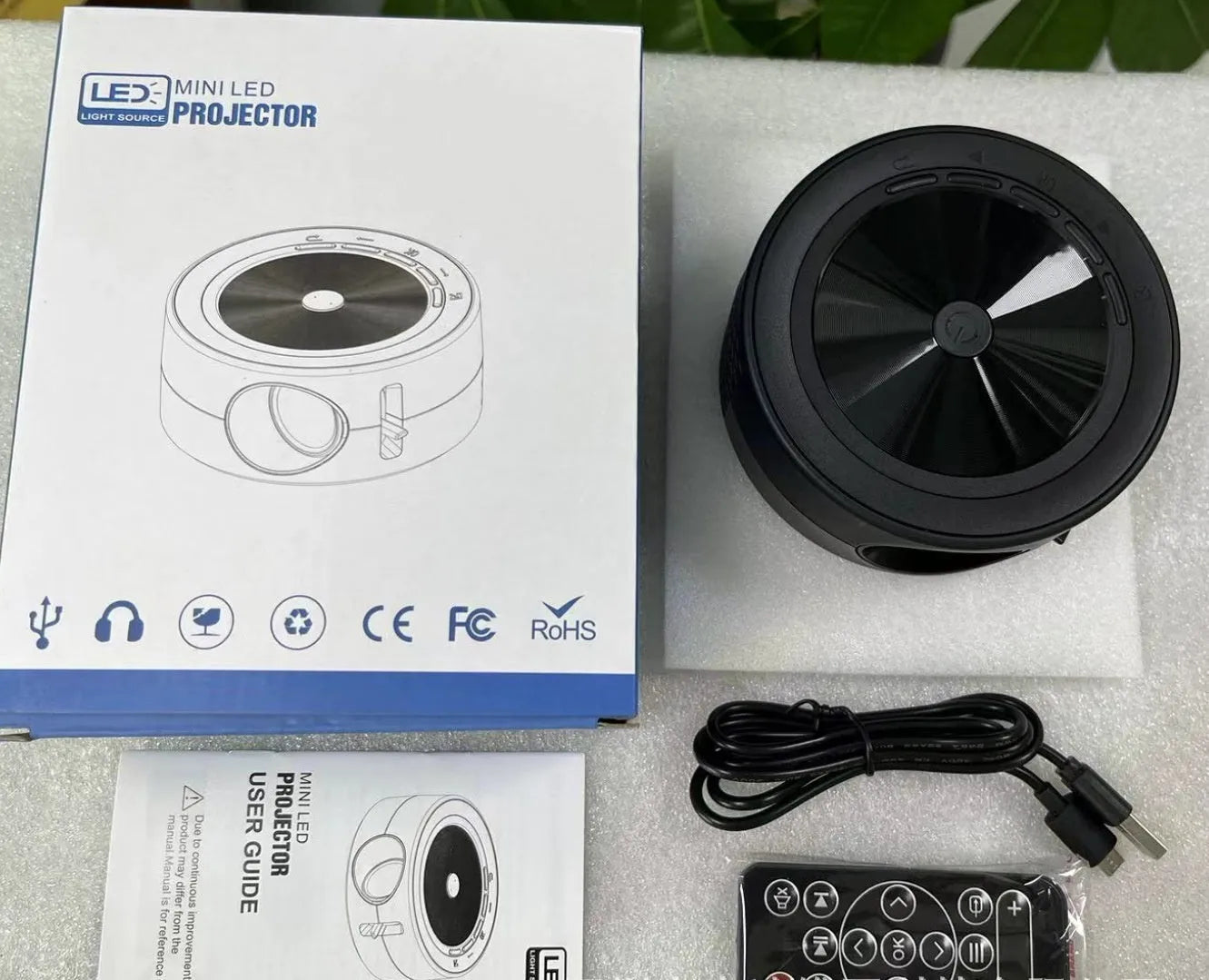 YT200 portable wired LED projector in black colour with remote control