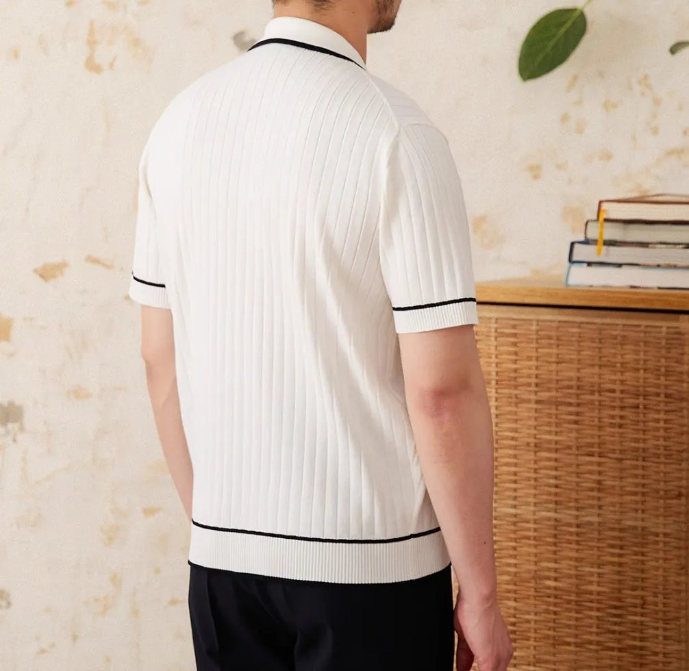 Slim black elastic lapel polo shirt on a hanger, showing short sleeves and knit texture.