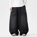 Men's plus size baggy blue denim jeans with a straight leg and low waist on a hanger.