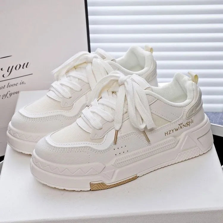 Children's beige board shoes with thick rubber sole, lace-up front, and cross shoulder straps.