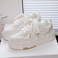 Children's beige board shoes with thick rubber sole, lace-up front, and cross shoulder straps.