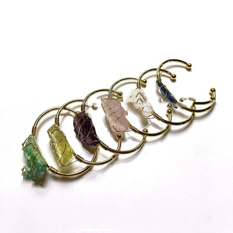 Natural crystal rough stone bracelet with gold winding geometric design showing colour mixing finish