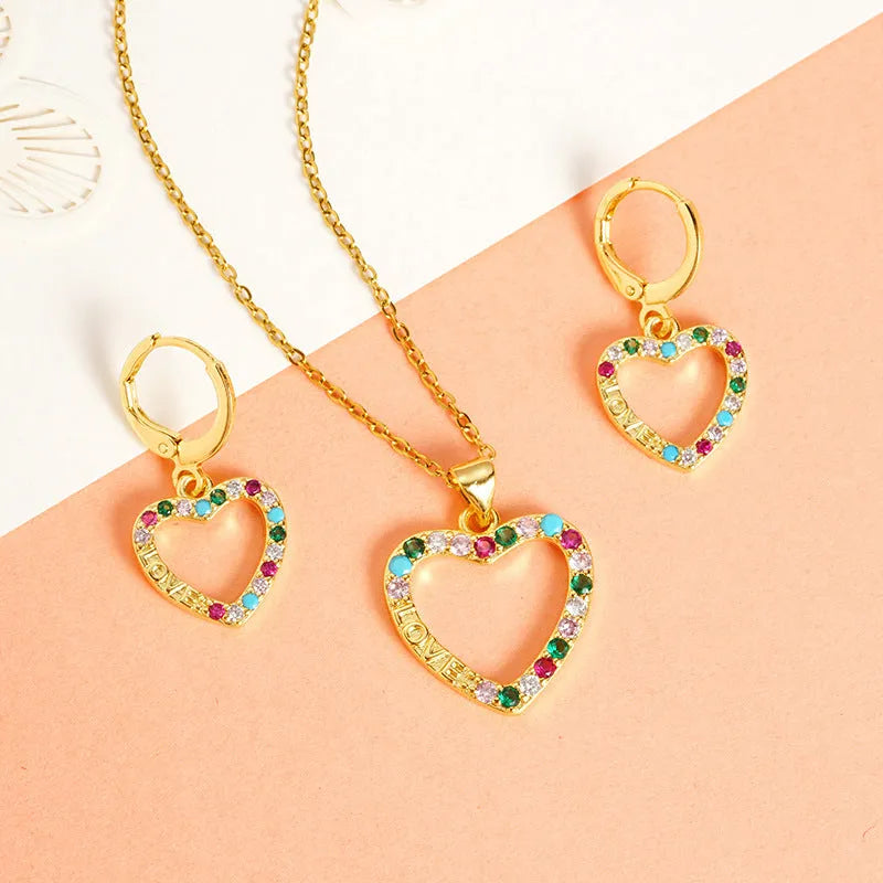 Gold light luxury necklace and earrings set with heart-shaped pendant and butterfly motif on copper alloy