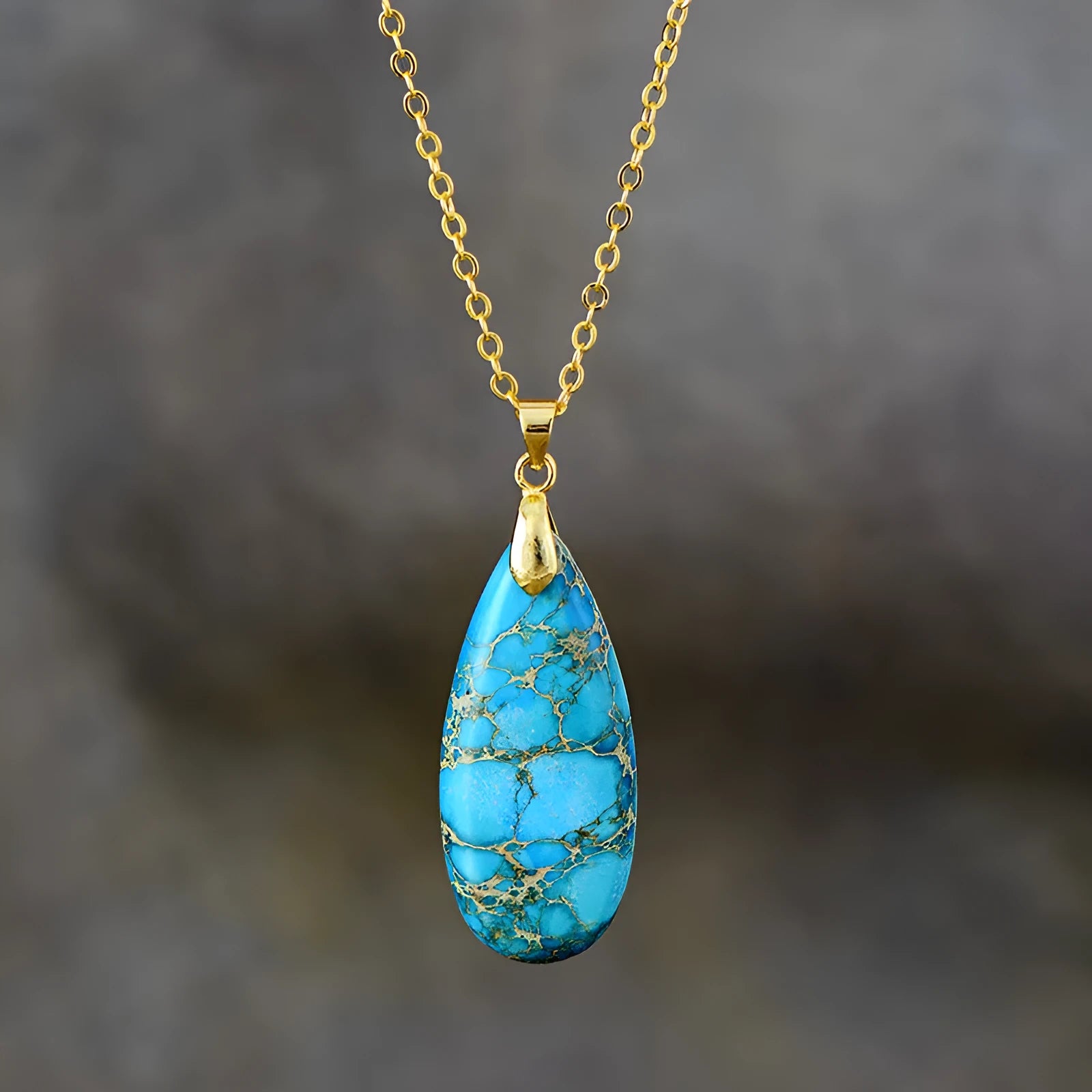Emperor Stone jade pendant necklace on an 18k gold plated chain with a water drop shape.
