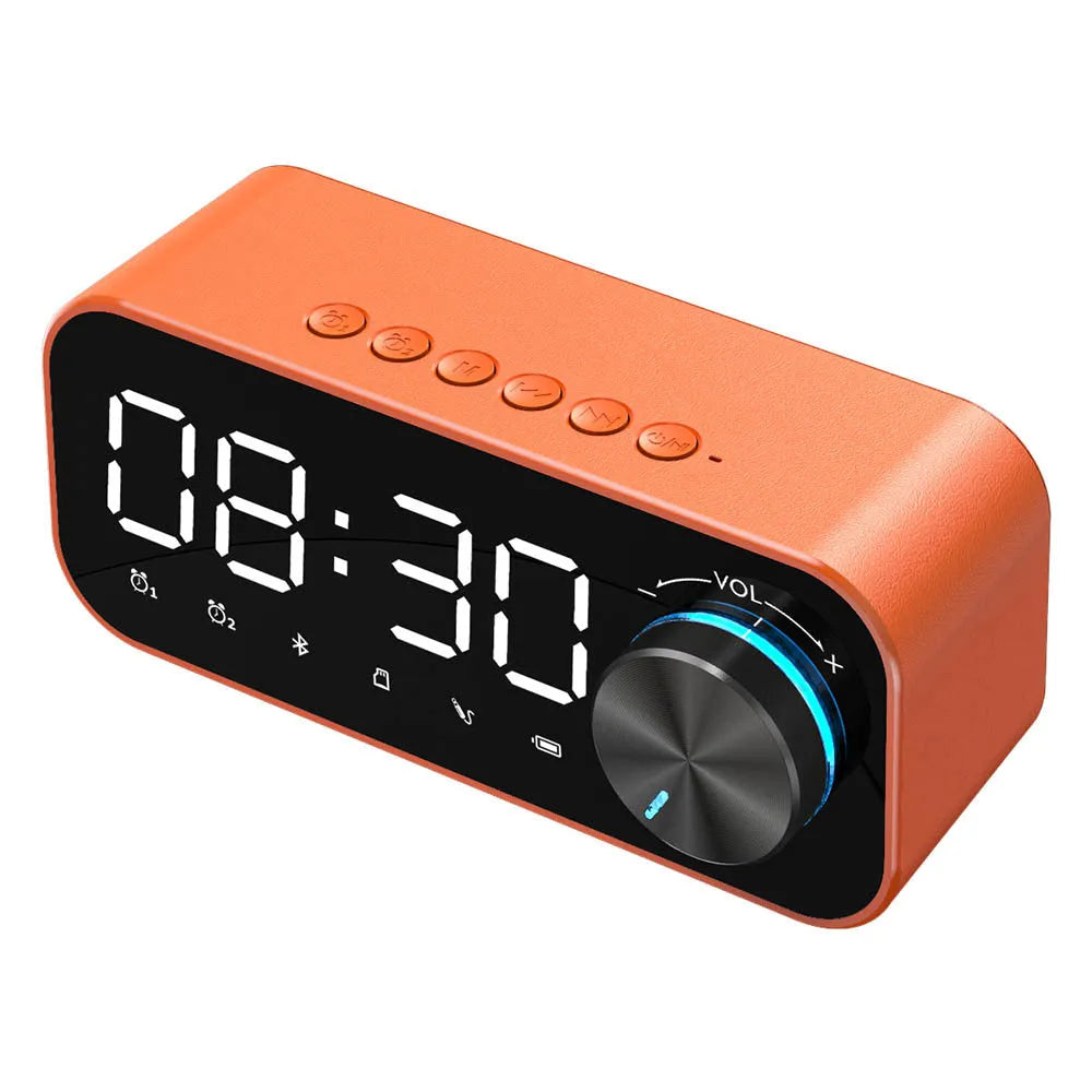 Black Bluetooth alarm clock speaker with LED digital display and night light on bedside table