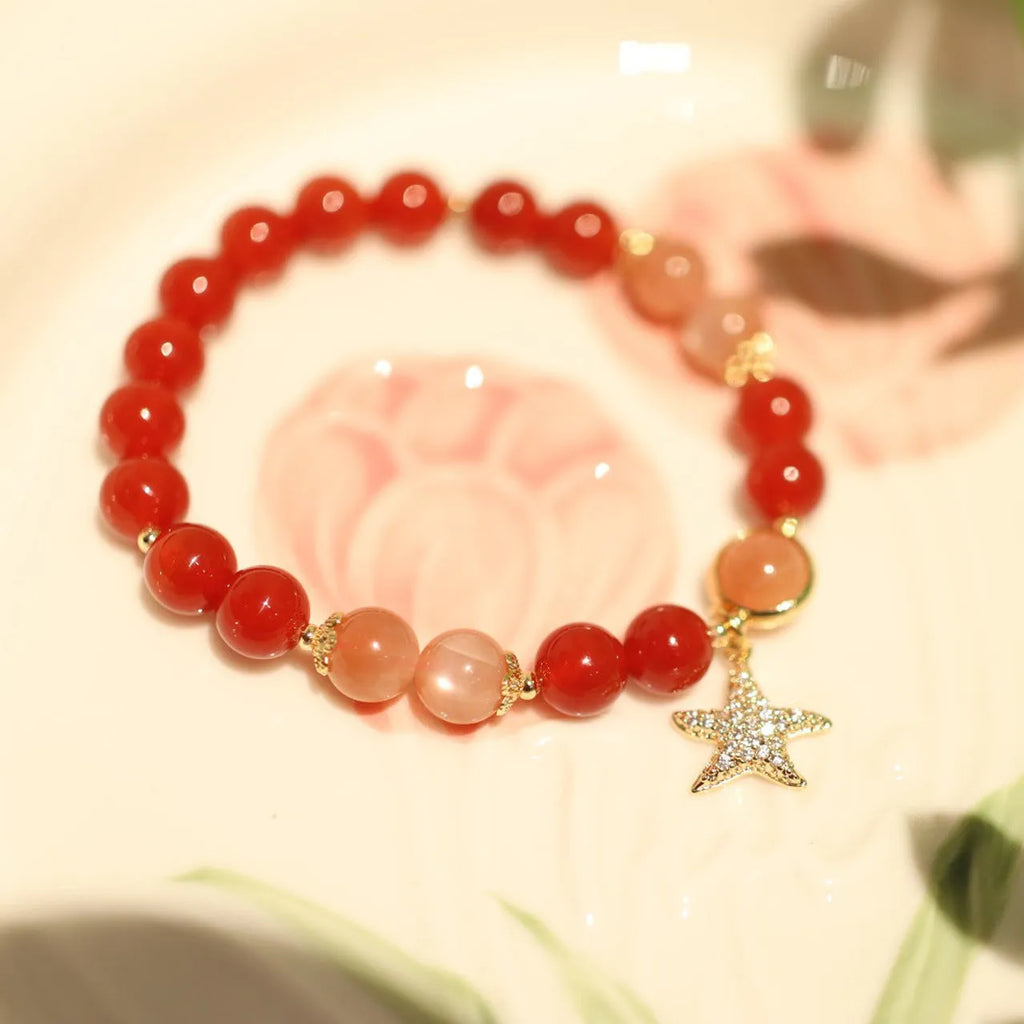 Handmade women's bracelet with 8mm red agate and sunstone beads in ethnic Xiangyun style