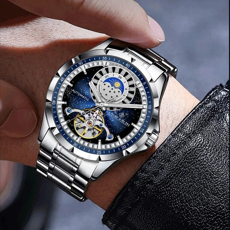 Silver and blue men's automatic mechanical watch with a stainless steel bracelet on a wrist
