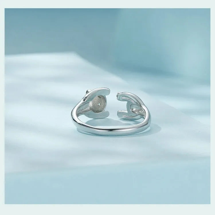 Adjustable sterling silver panda open ring with white gold plating on a finger