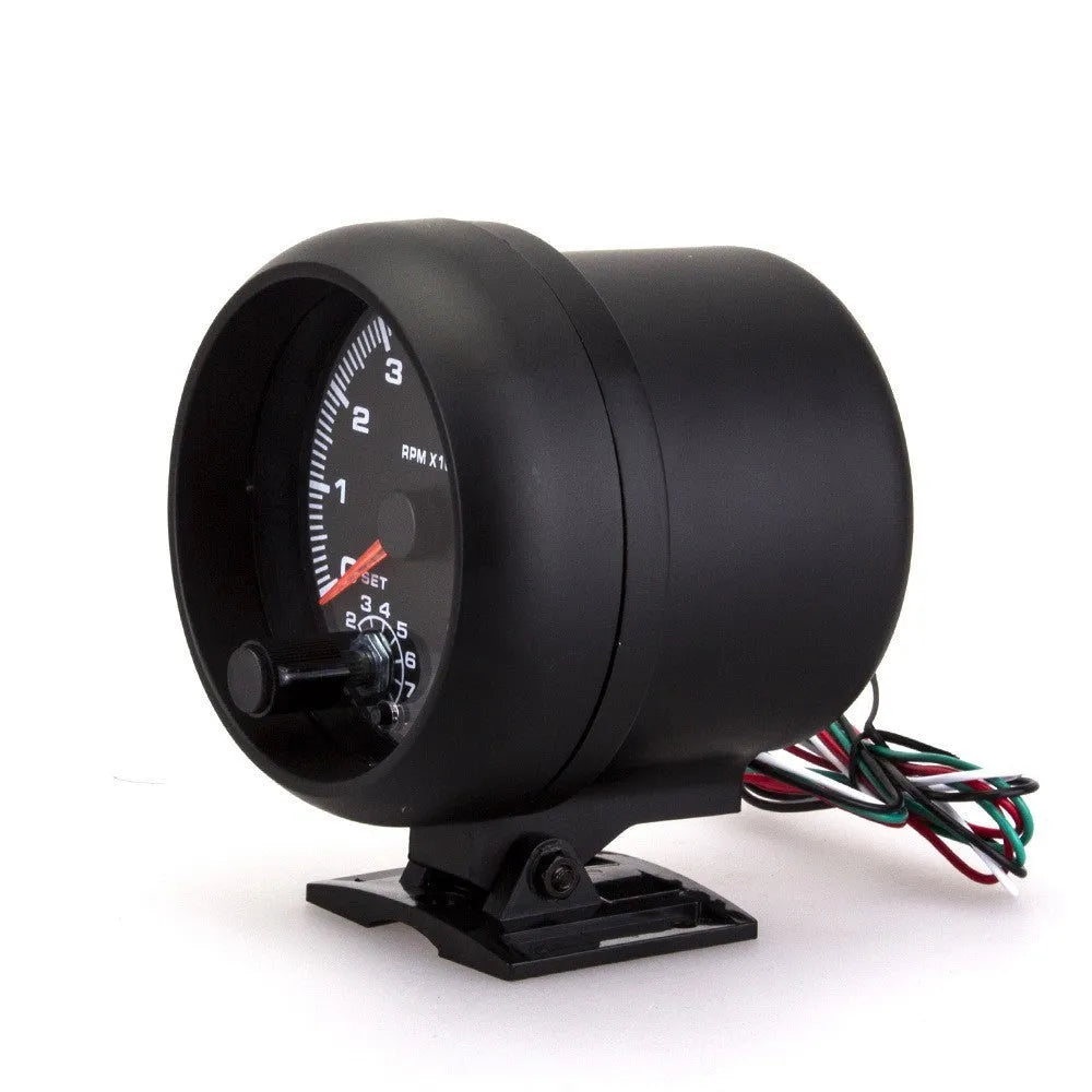 Black plastic automotive tachometer with blue light pointer display for engine speed measurement