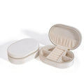 Oval velvet jewelry storage box in lake blue colour with flannel lining, shown open.