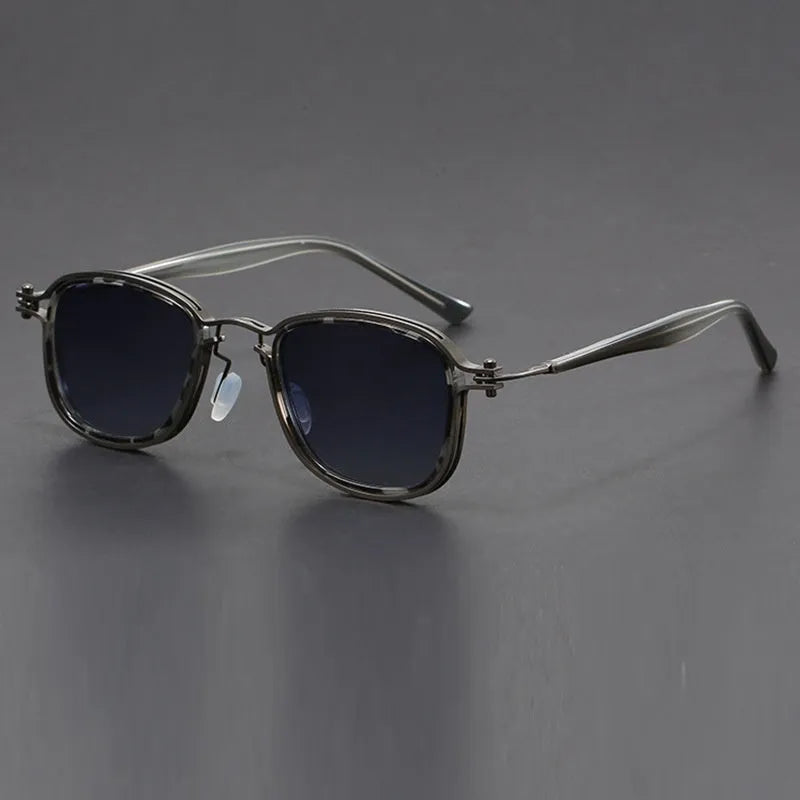 Retro style square frame sunglasses with metal and plastic construction in a black gold full gray colour.