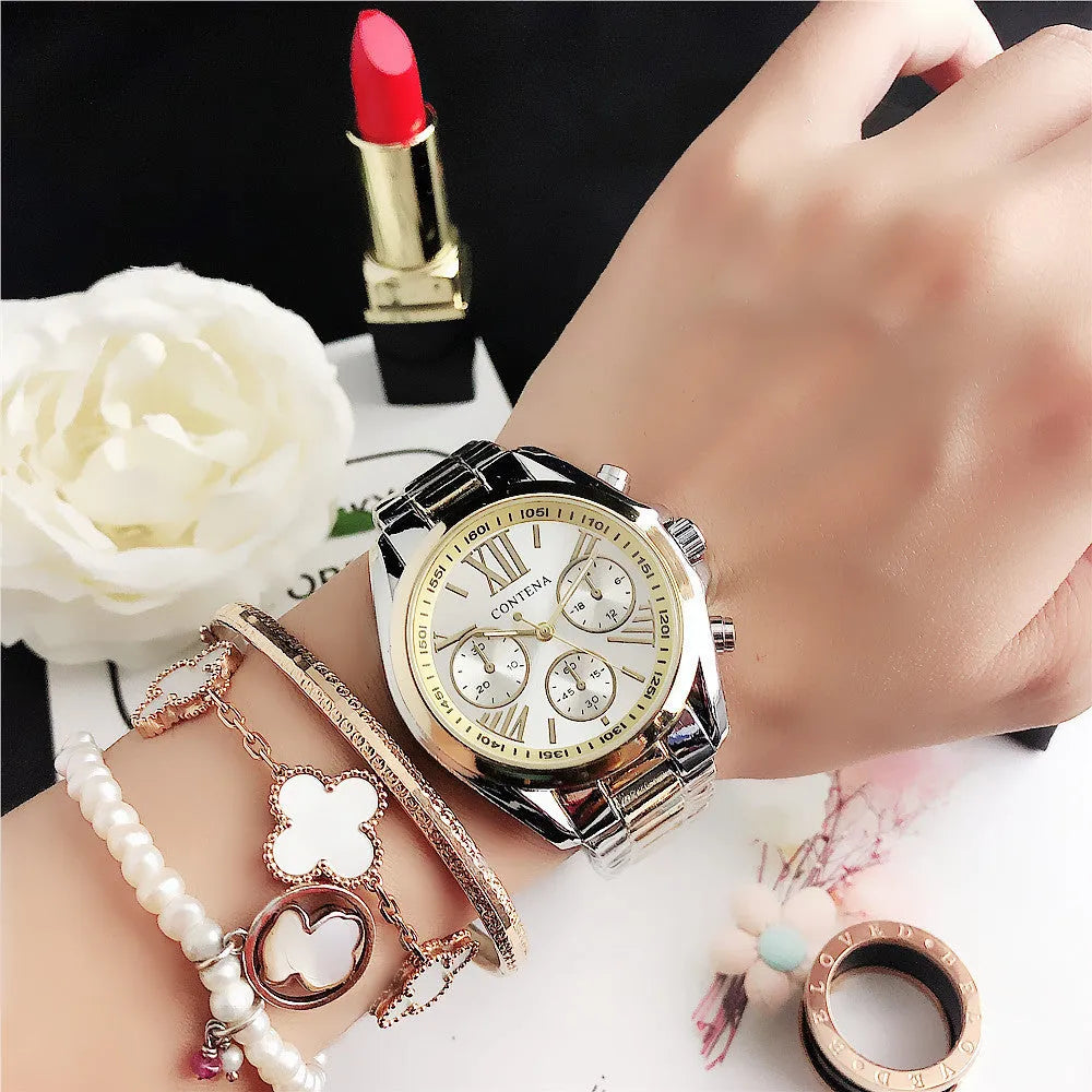 Women's silver and rose gold quartz watch with mesh strap and pointer display.
