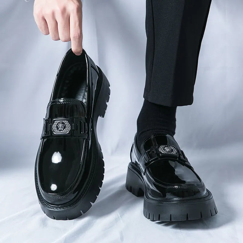 Men's glossy black platform loafers with hidden low heel, showing PU leather construction