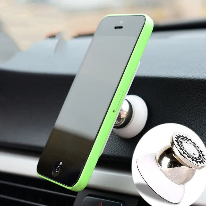 Magnetic car phone holder in black with alloy metal construction on car dashboard